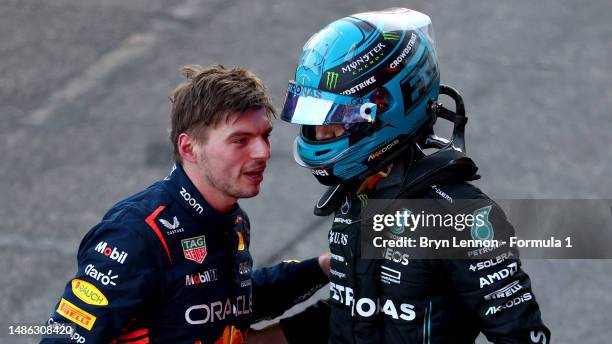 Third placed Max Verstappen of the Netherlands and Oracle Red Bull Racing and 4th placed George Russell of Great Britain and Mercedes talk in parc...