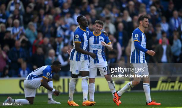 Danny Welbeck of Brighton & Hove Albion celebrates with team mate Billy Gilmour after scoring their sides fourth goal during the Premier League match...