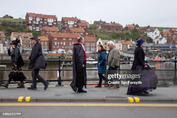 Visitors wear gothic clothing as they attend the Whitby Goth Weekend on April 29, 2023 in Whitby, England. The original Whitby Goth Weekend event...