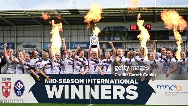 England captain Jodie Cunningham lifts the Mid Season International trophy after winning the Mid-Season Rugby League International between England...