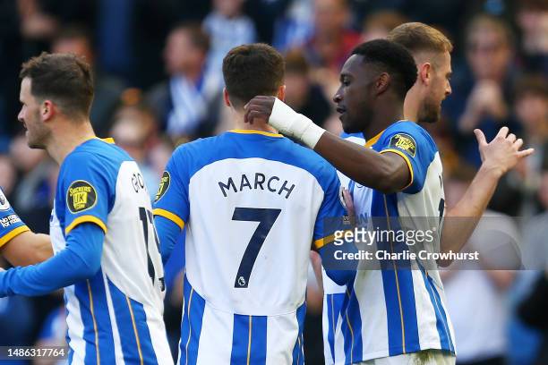Danny Welbeck of Brighton & Hove Albion celebrates with team mate Solly March after scoring their sides fifth goal during the Premier League match...