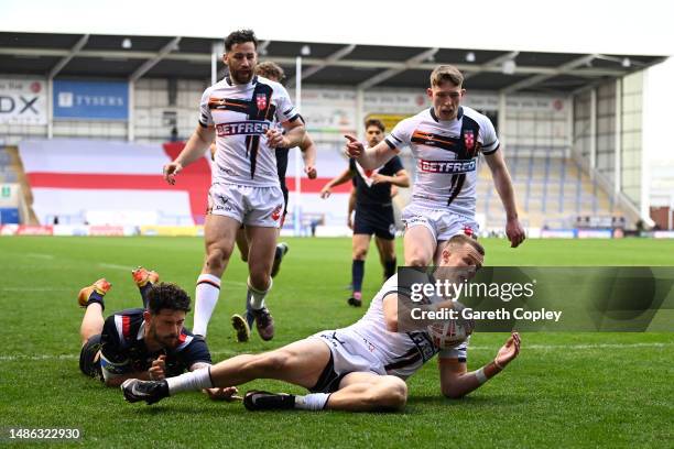 Ash Handley of England scores the team's first try during the Mid-Season Rugby League International match between England and France at The Halliwell...