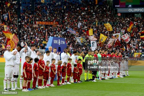 Players of AC Milan and AS Roma line up on the pitch prior to the Serie A match between AS Roma and AC MIlan at Stadio Olimpico on April 29, 2023 in...