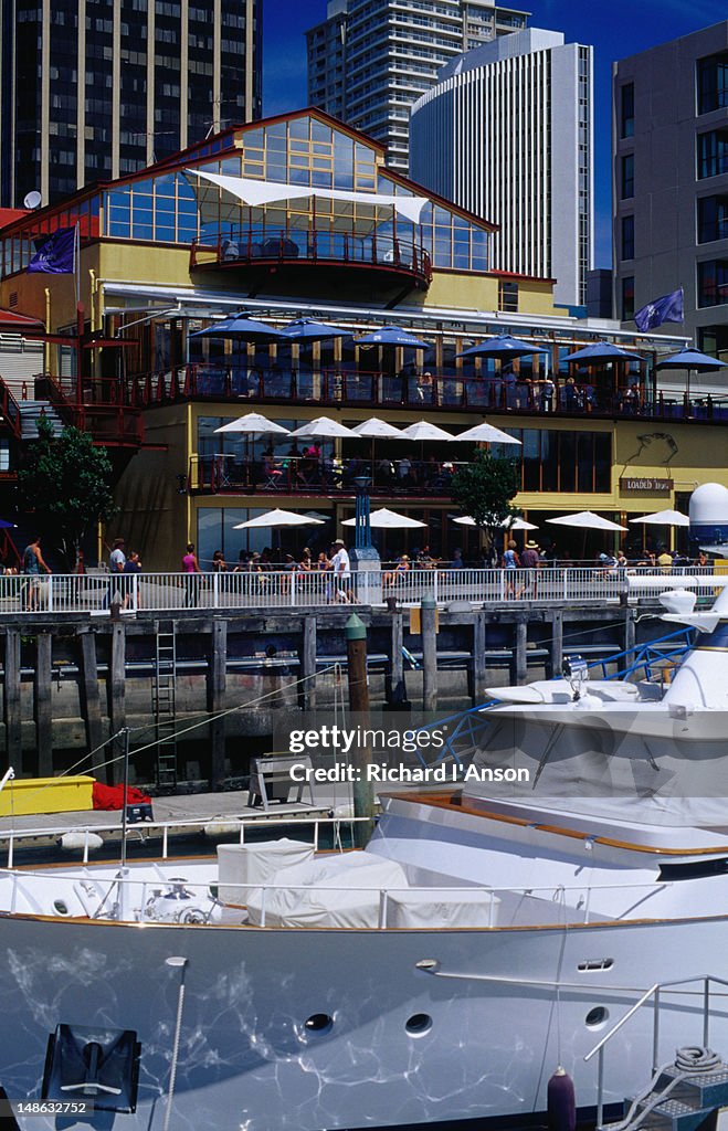 Boats moored in Viaduct Basin & waterside restaurants.