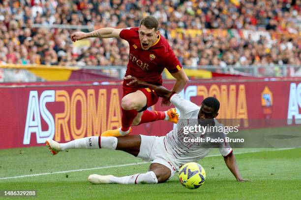 Andrea Belotti of AS Roma clashes with Fikayo Tomori of AC Milan during the Serie A match between AS Roma and AC MIlan at Stadio Olimpico on April...