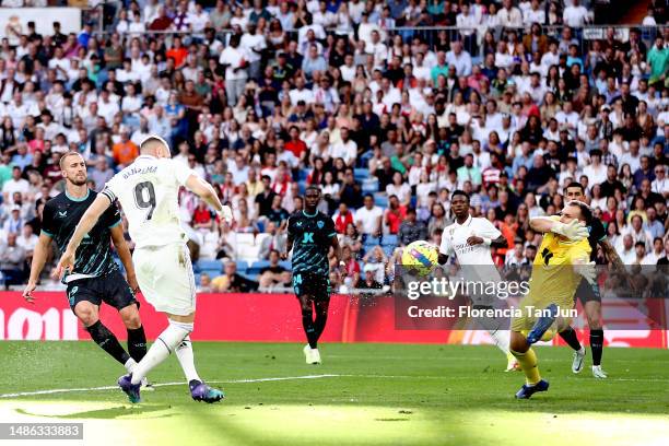 Karim Benzema of Real Madrid scores the team's first goal during the LaLiga Santander match between Real Madrid CF and UD Almeria at Estadio Santiago...