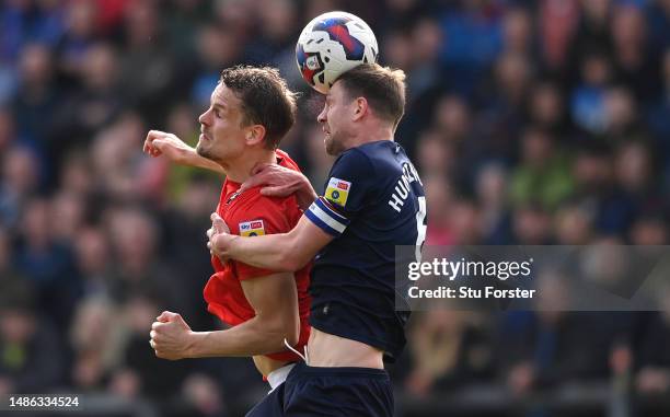 Salford striker Matt Smith is challenged by Carlisle defender Paul Huntington during the Sky Bet League Two between Carlisle United and Salford City...