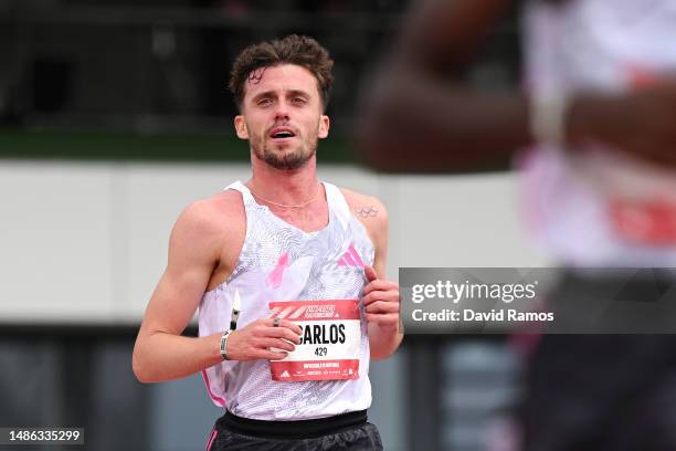 Carlos Mayo of Spain crosses the finish line in the Men's 10km race during the Adizero: Road To Records 2023 on April 29, 2023 in Herzogenaurach,...