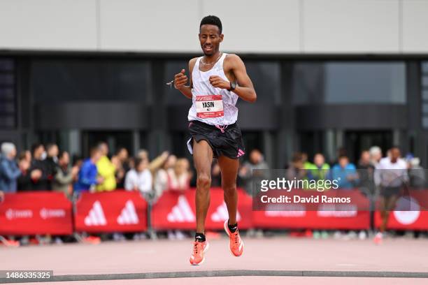 Yasin Haji of Ethiopia crosses the finish line in the Men's 10km race during the Adizero: Road To Records 2023 on April 29, 2023 in Herzogenaurach,...