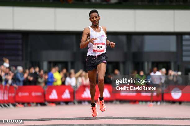 Yasin Haji of Ethiopia crosses the finish line in the Men's 10km race during the Adizero: Road To Records 2023 on April 29, 2023 in Herzogenaurach,...