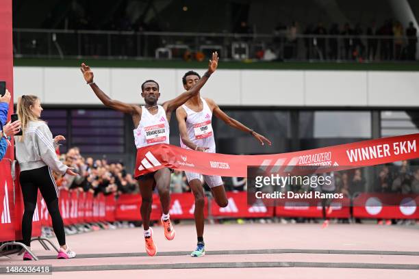 Birhanu Balew of Bahrain celebrates as they cross the finish line to win the Men's 5km race during the Adizero: Road To Records 2023 on April 29,...