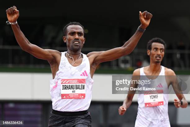 Birhanu Balew of Bahrain celebrates as they cross the finish line to win the Men's 5km race during the Adizero: Road To Records 2023 on April 29,...