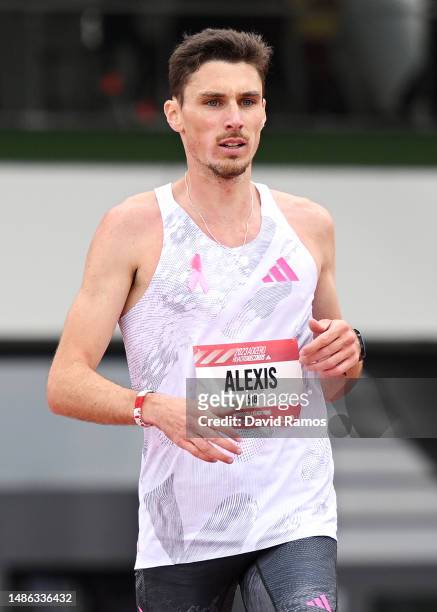 Alexis Miellet of France crosses the finish line in the Men's 5km race during the Adizero: Road To Records 2023 on April 29, 2023 in Herzogenaurach,...