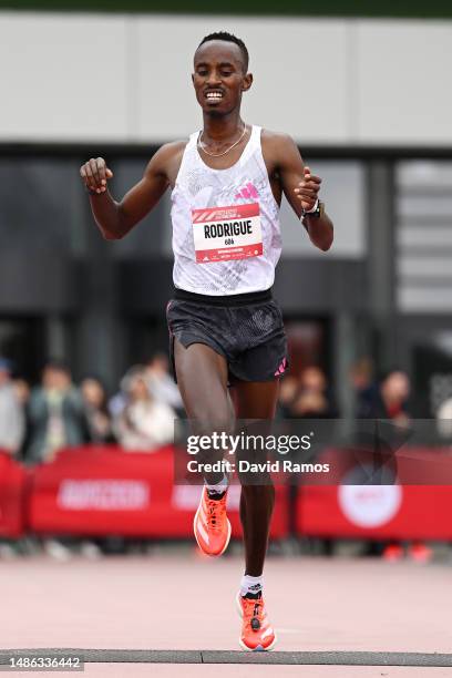 Rodrigue Kwizera of Burundi crosses the finish line in the Men's 5km race during the Adizero: Road To Records 2023 on April 29, 2023 in...