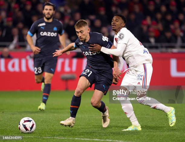 Valentin Rongier of Marseille, Jeffinho of Lyon during the Ligue 1 Uber Eats match between Olympique Lyonnais and Olympique de Marseille at Groupama...