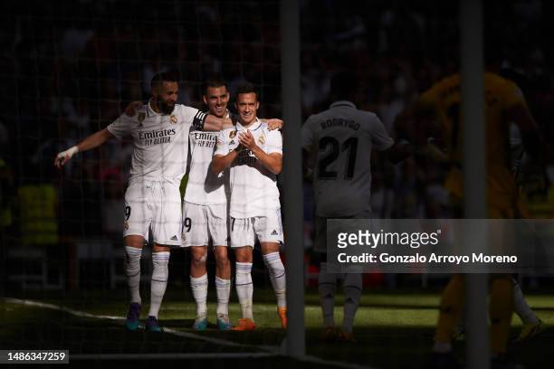 Karim Benzema of Real Madrid CF celebrates scoring their second goal with teammate Dani Ceballos and Lucas Vazquez during the LaLiga Santander match...