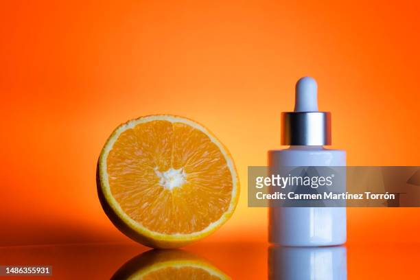 vitamin c. - dropper bottle stock pictures, royalty-free photos & images