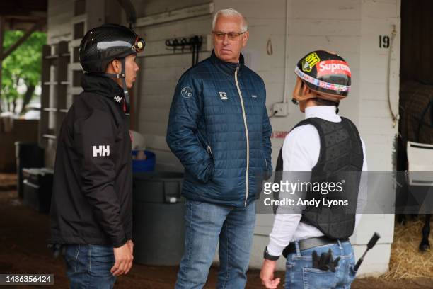 Todd Pletcher the trainer of Forte, Kingsbarns and Tapit Trice talks with jockey Irad Ortiz Jr. Outside his barn during the morning training for the...