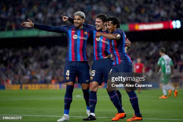 Andreas Christensen of FC Barcelona celebrates with teammates Ronald Araujo and Jules Kounde of FC Barcelona after scoring the team's first goal...