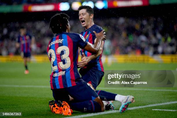 Robert Lewandowski of FC Barcelona celebrates with teammate Jules Kounde after scoring the team's second goal during the LaLiga Santander match...