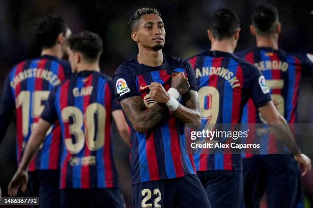 Raphinha of FC Barcelona celebrates after scoring the team's third goal during the LaLiga Santander match between FC Barcelona and Real Betis at...