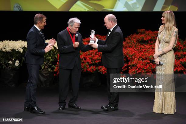 Ezio Greggio, Costa-Gavras, Prince Albert II of Monaco and Elenoire Casalegno are seen on stage with an award during the 20th Monte-Carlo Film...