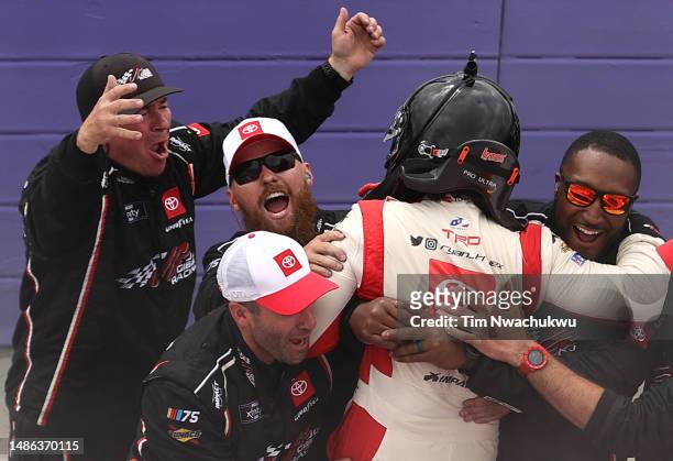Ryan Truex, driver of the Toyota Genuine Accessories Toyota, and crew celebrate after winning the NASCAR Xfinity Series A-GAME 200 at Dover...