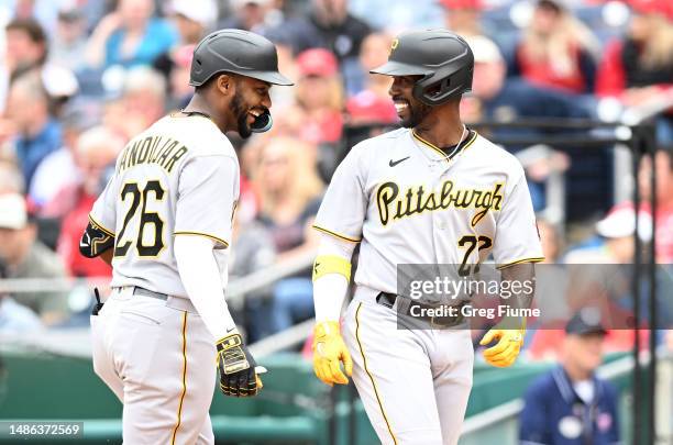 Miguel Andujar of the Pittsburgh Pirates celebrates with Andrew McCutchen after hitting a two-run home run in the sixth inning against the Washington...