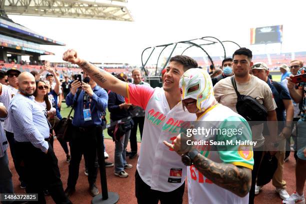 Fighter Brandon Moreno and Mexican luchador Rey Mysterio pose for fans prior to the MLB World Tour Mexico City Series between the San Francisco...