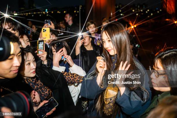 Lee Hye-In aka Hyein of girl group NewJeans is seen in the front row during the Louis Vuitton Pre-Fall 2023 Show on the Jamsugyo Bridge at the...