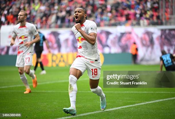 Christopher Nkunku of RB Leipzig celebrates after scoring his sides first goal during the Bundesliga match between RB Leipzig and TSG Hoffenheim at...