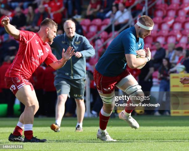 Vaea Fifita of the Scarlets warms up ahead of the Semi Finals of the EPCR Challenge Cup between the Scarlets and the Glasgow Warriors at Parc y...