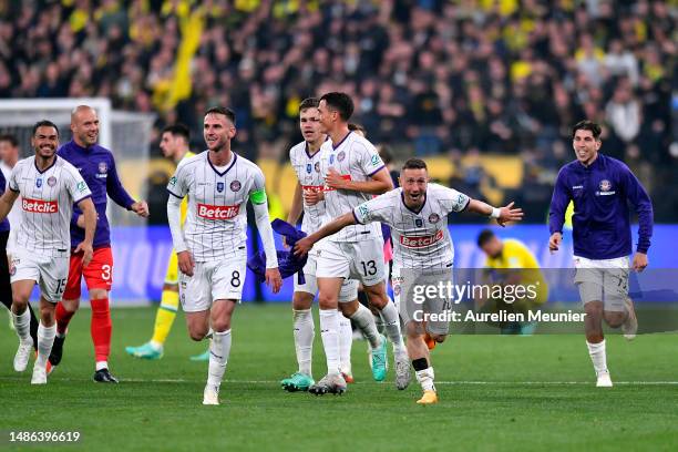 Brecht Emiel Dejaere and Branco Van Den Boomen of Toulouse FC react after winning the French Cup Final match against FC Nantes at Stade de France on...