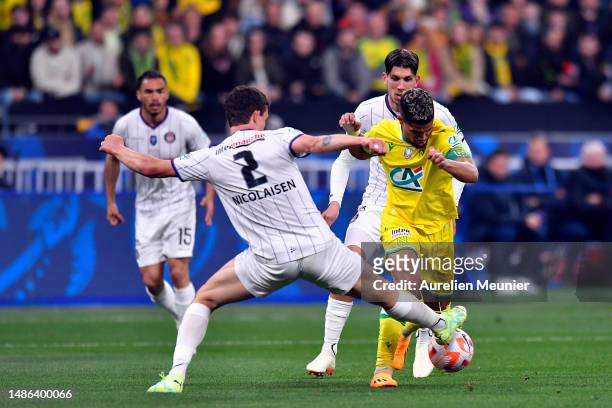Rasmus Nicolaisen of Toulouse FC and Ludovic Blasof FC Nantes fight for possession during the French Cup Final match between FC Nantes and Toulouse...
