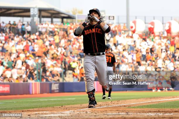 Brandon Crawford of the San Francisco Giants touches the plate after a solo homerun during the third inning of the MLB World Tour Mexico City Series...