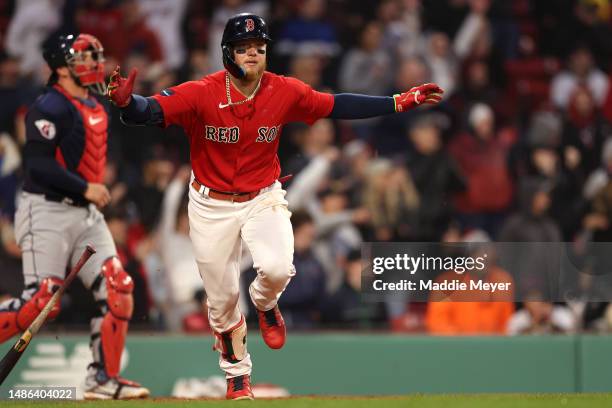 Alex Verdugo of the Boston Red Sox celebrates after hitting an RBI single to defeat the Cleveland Guardians during the tenth inning at Fenway Park on...