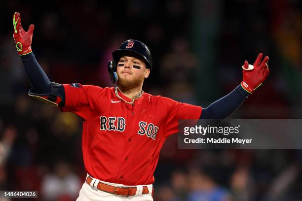 Alex Verdugo of the Boston Red Sox celebrates after hitting an RBI single to defeat the Cleveland Guardians during the tenth inning at Fenway Park on...
