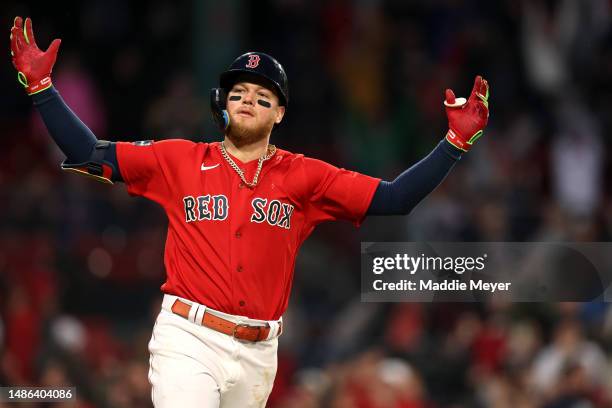 Alex Verdugo of the Boston Red Sox celebrates after hitting an RBI single to defeat the Cleveland Guardians during the tenth inning at Fenway Park on...
