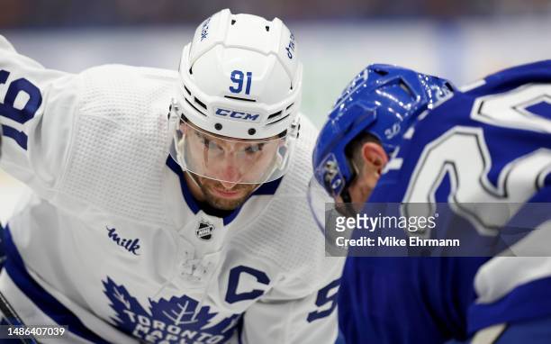 John Tavares of the Toronto Maple Leafs faces off in the first period during Game Six of the First Round of the 2023 Stanley Cup Playoffs against the...