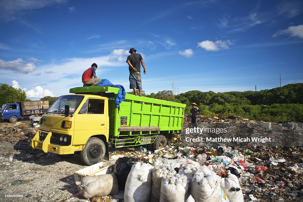 Truck dumping rubbish in an illegal dump.