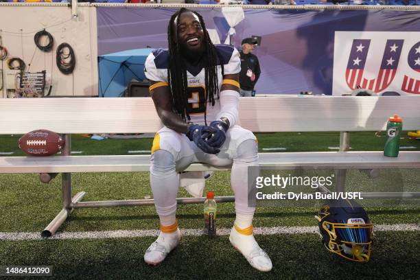 Alex Collins of Memphis Showboats reacts after throwing a pass for a touchdown during the second quarter against the Houston Gamblers at Simmons Bank...