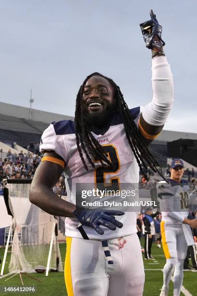 Alex Collins of Memphis Showboats reacts after throwing a pass for a touchdown during the second quarter against the Houston Gamblers at Simmons Bank...