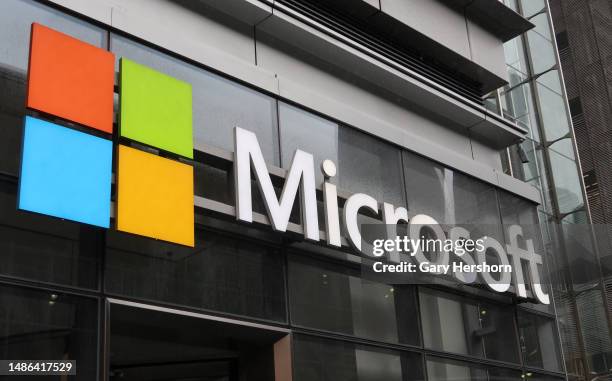 Microsoft corporate logo hangs on the side of their office building on Eighth Avenue on April 29 in New York City.
