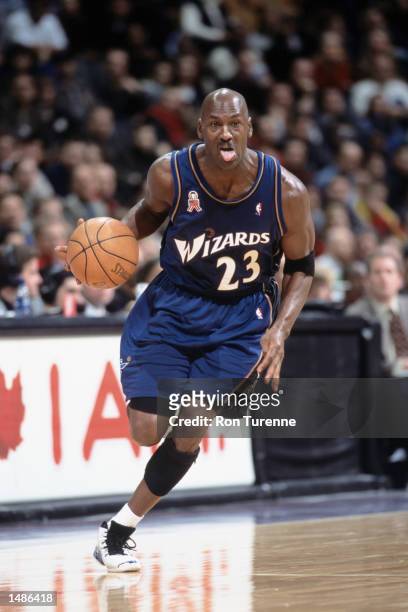 Washington Wizards forward Michael Jordan dribbles the ball during the NBA game against the Toronto Raptors at the Air Canada Centre in Toronto,...
