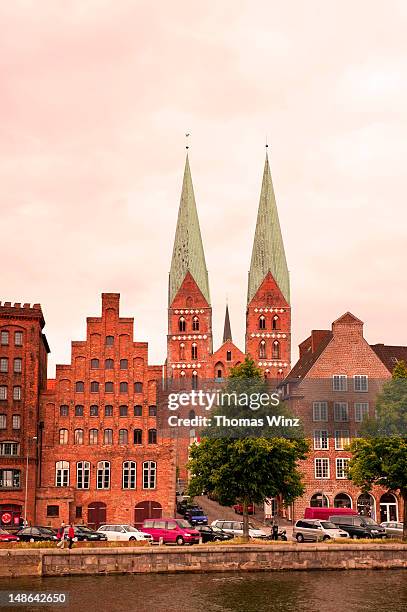 st mary's church and river trave. - lübeck stock pictures, royalty-free photos & images