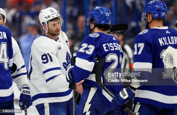 John Tavares of the Toronto Maple Leafs shakes hands after winning Game Six of the First Round of the 2023 Stanley Cup Playoffs against the Tampa Bay...