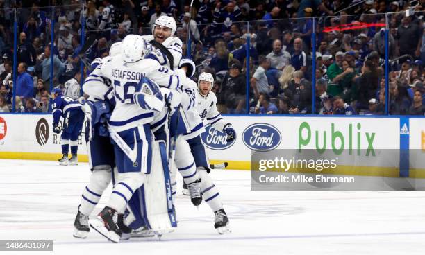 The Toronto Maple Leafs celebrate winning Game Six of the First Round of the 2023 Stanley Cup Playoffs on an overtime goal by John Tavares against...