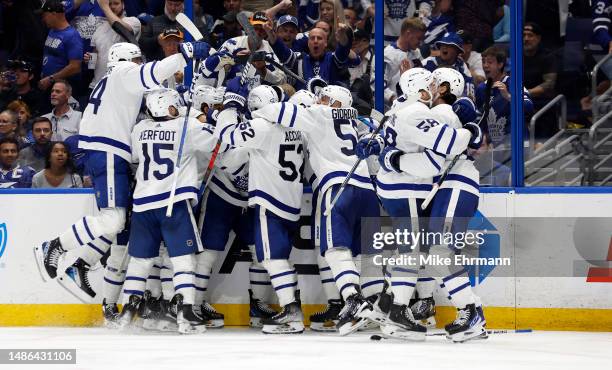 The Toronto Maple Leafs celebrate winning Game Six of the First Round of the 2023 Stanley Cup Playoffs on an overtime goal by John Tavares against...