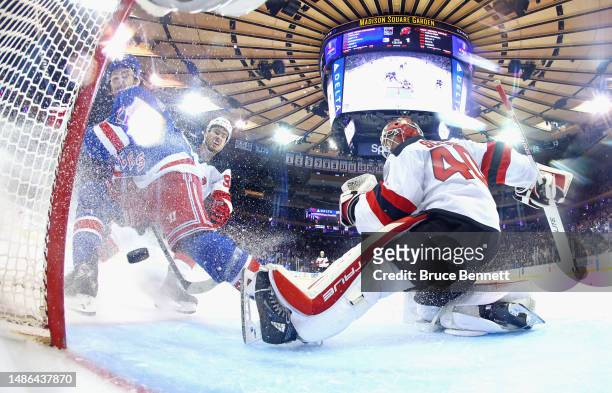 Barclay Goodrow of the New York Rangers scores on Akira Schmid of the New Jersey Devils during the third period in Game Six of the First Round of the...
