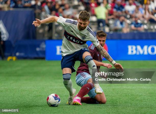 Tristan Blackmon of the Vancouver Whitecaps FC tries to evade Diego Rubio 0f the Colorado Rapids at BC Place on April 29, 2023 in Vancouver, Canada.